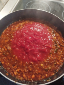 Add the tomatoes to the pan