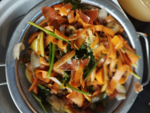 Vegetable peels needs to be drained from the liquid in a colander.